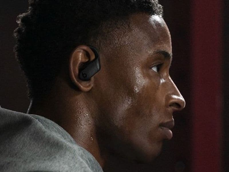 Athlete wearing Beats Powerbeats Pro 2 earbuds during a workout