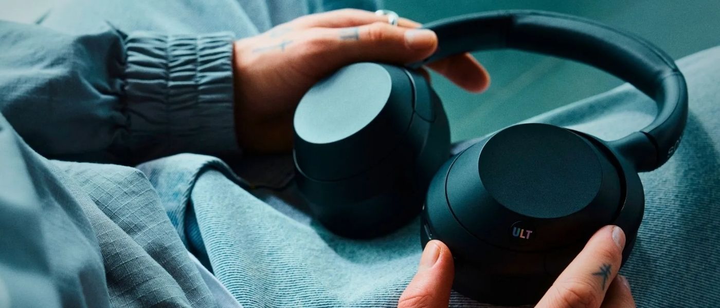 Sony ULT Wear noise-cancelling headphones held in hands