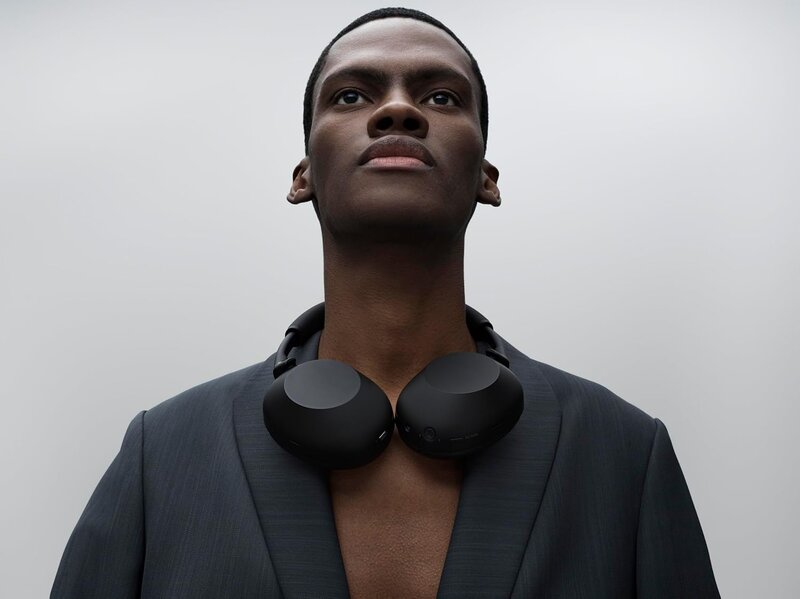 Commuter wearing Sony WH-1000XM6 headphones